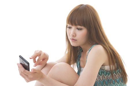 Young woman to see a smartphoneの写真素材