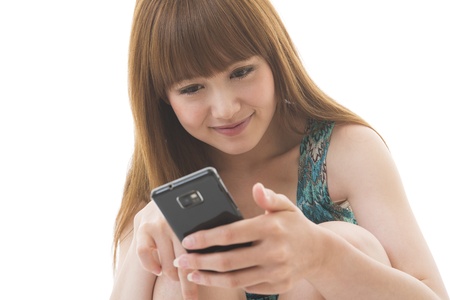 Young woman to see a smartphoneの写真素材
