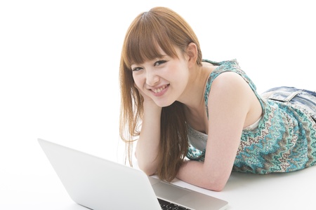 Young woman to see a computerの写真素材