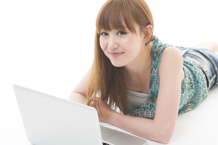 Young woman to see a computerの写真素材