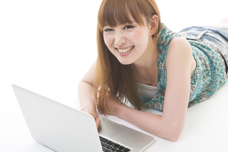 Young woman to see a computerの写真素材