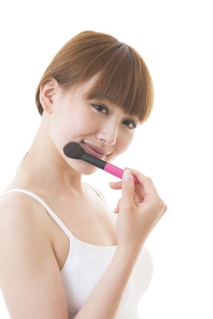 The young woman who makes upの写真素材