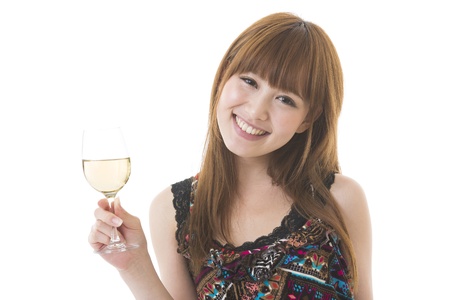 The young woman who drinks wineの写真素材