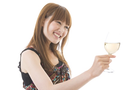 The young woman who drinks wineの写真素材