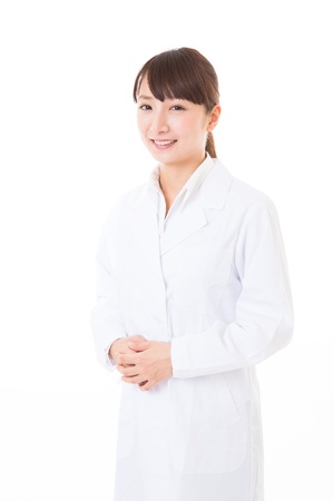 Young woman in a white coatの写真素材