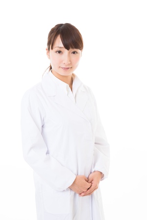 Young woman in a white coatの写真素材