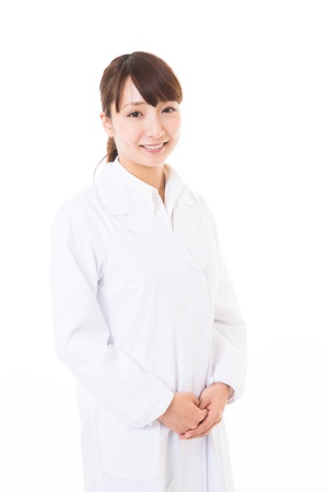 Young woman in a white coatの写真素材