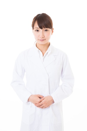 Young woman in a white coatの写真素材