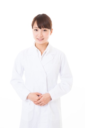 Young woman in a white coatの写真素材