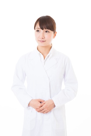 Young woman in a white coatの写真素材