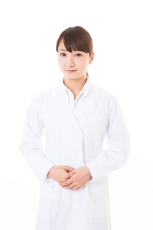 Young woman in a white coatの写真素材
