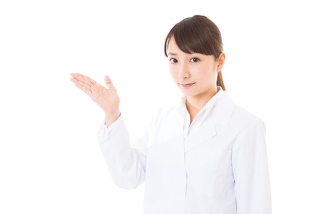 Young woman in a white coatの写真素材