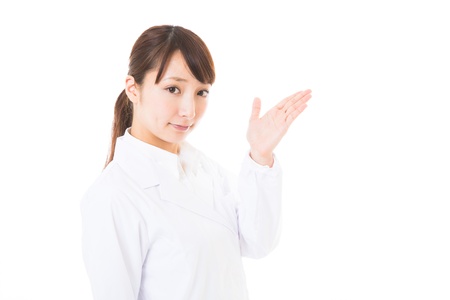 Young woman in a white coatの写真素材