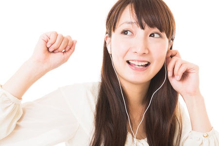 The woman who is relaxed while listening to musicの写真素材