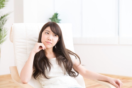 The young woman relaxing in the roomの写真素材