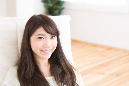 The young woman relaxing in the roomの写真素材