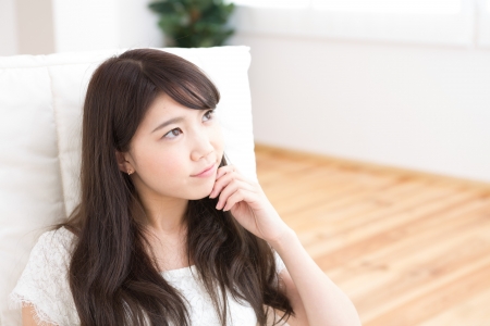 The young woman relaxing in the roomの写真素材