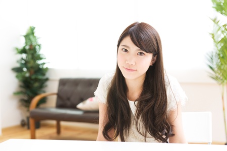 The young woman relaxing in the roomの写真素材