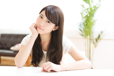 The young woman relaxing in the roomの写真素材