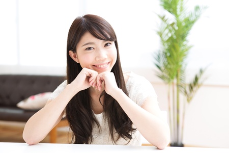 The young woman relaxing in the roomの写真素材