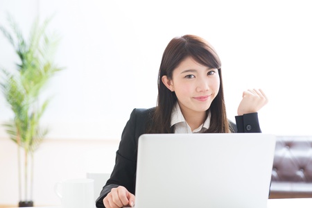 Young businesswoman who uses the computerの写真素材