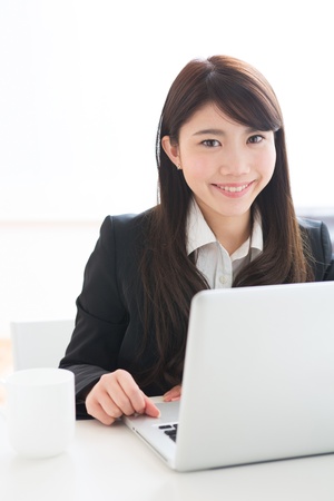 Young businesswoman who uses the computerの写真素材