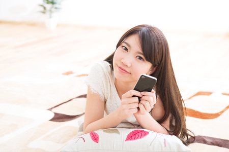 The woman who uses the smartphoneの写真素材