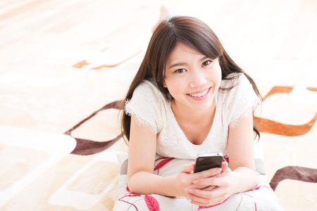The woman who uses the smartphoneの写真素材