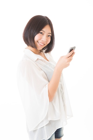 Young woman to see a smart phoneの写真素材