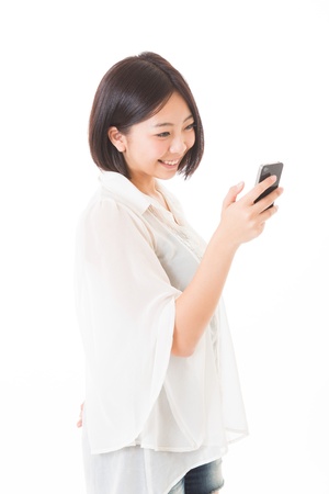 Young woman to see a smart phoneの写真素材