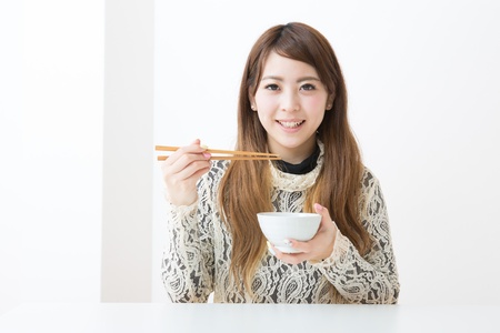 The young woman who eatsの写真素材