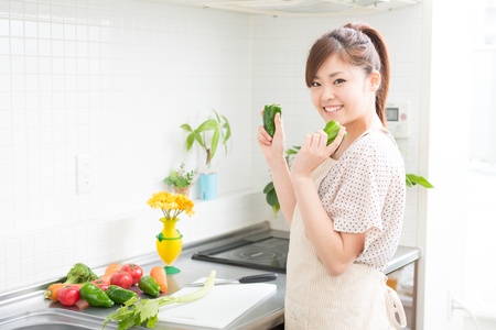 woman who cooks with an apron figureの写真素材
