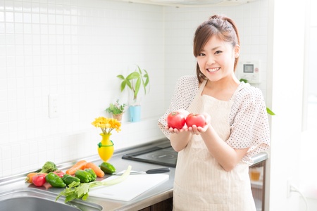 woman who cooks with an apron figureの写真素材