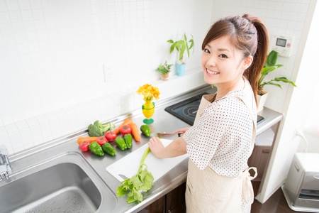 woman who cooks with an apron figureの写真素材