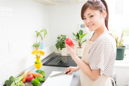 woman who cooks with an apron figureの写真素材
