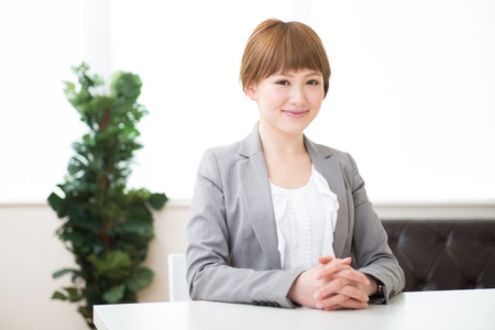 Beautiful young asian businesswoman who smile in a officeの写真素材