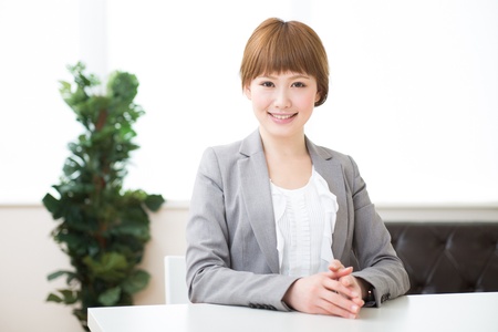 Beautiful young asian businesswoman who smile in a officeの写真素材