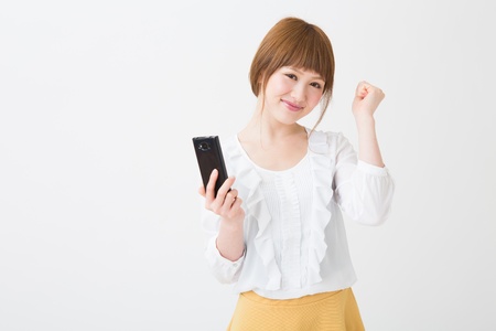 Young businesswoman to see a smart phoneの写真素材