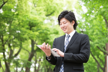 young businessman using tablet computerの写真素材
