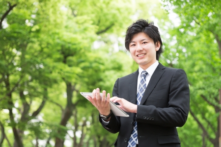 young businessman using tablet computerの写真素材