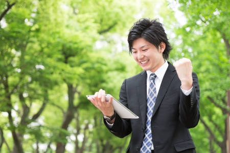 young businessman using tablet computerの写真素材