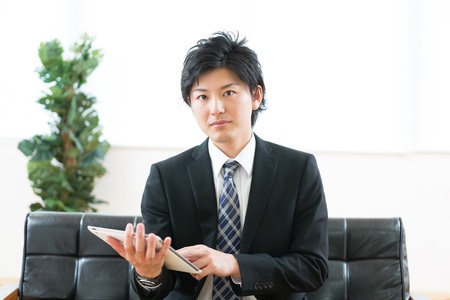 young businessman using tablet computerの写真素材