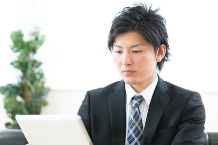 young businessman using tablet computerの写真素材