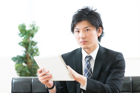 young businessman using tablet computerの写真素材
