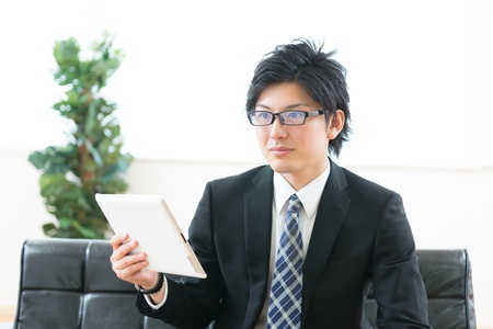 young businessman using tablet computerの写真素材