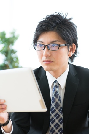 young businessman using tablet computerの写真素材