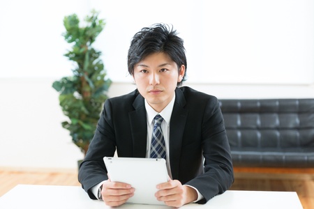 young businessman using tablet computerの写真素材