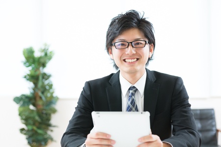 young businessman using tablet computerの写真素材