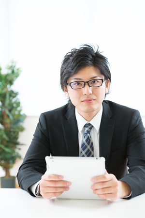 young businessman using tablet computerの写真素材