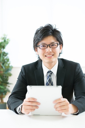 young businessman using tablet computerの写真素材
